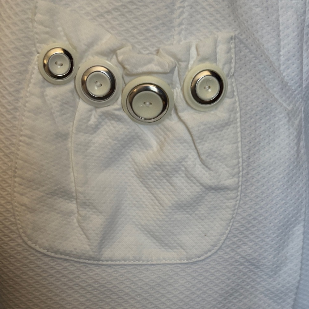 Elegant White Sleeveless Dress with Whimsical Button Detailing - Picture 2 of 7